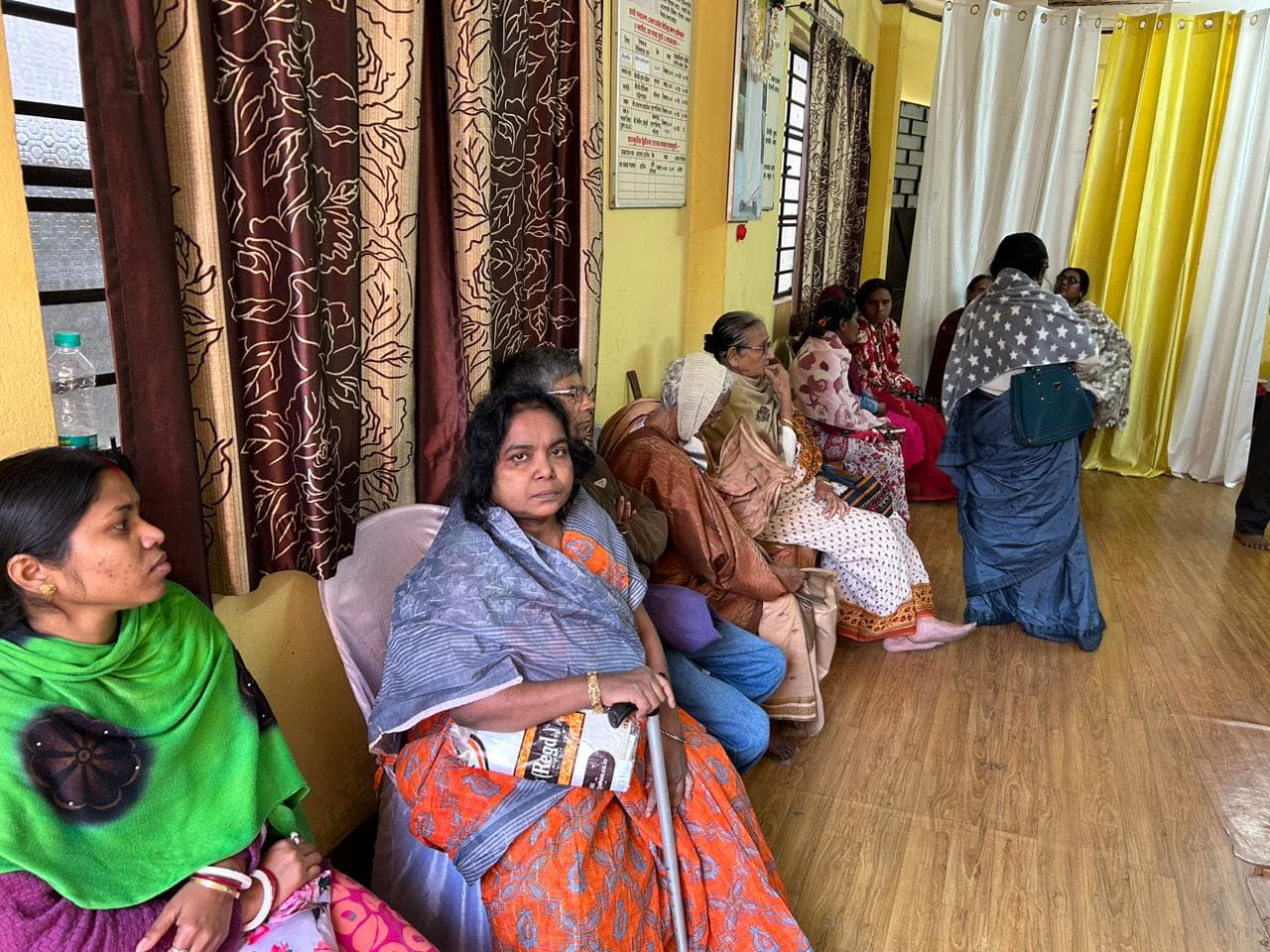 A medical camp: people gathered as doctors and volunteers attend to them