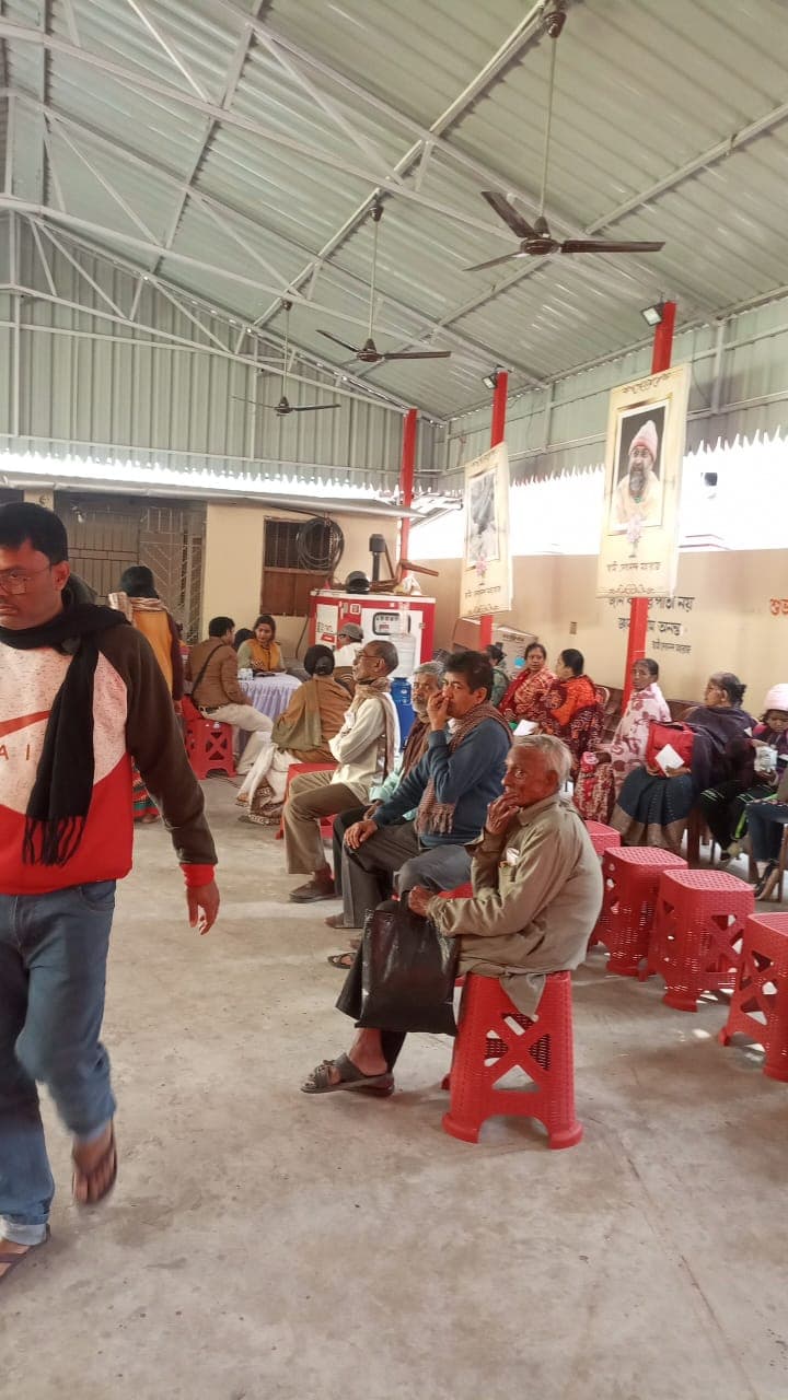 A medical camp: people gathered as doctors and volunteers attend to them