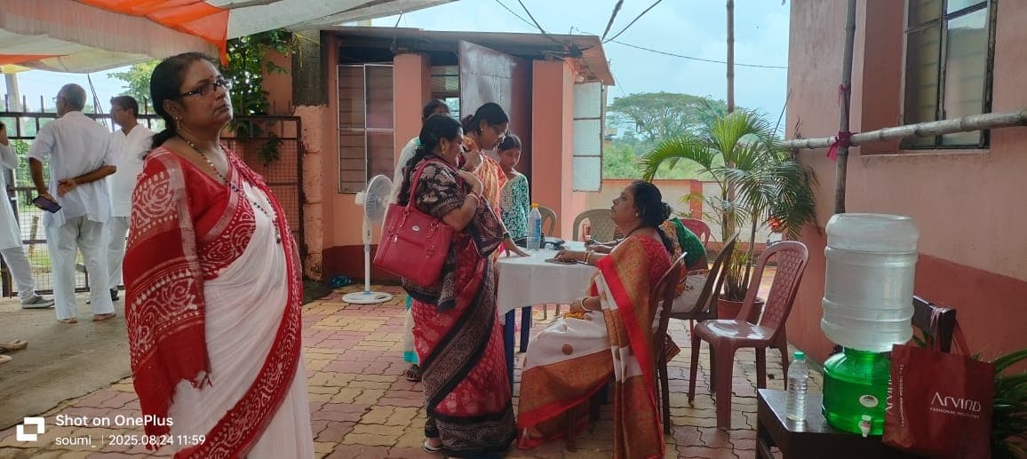 A medical camp: people gathered as doctors and volunteers attend to them