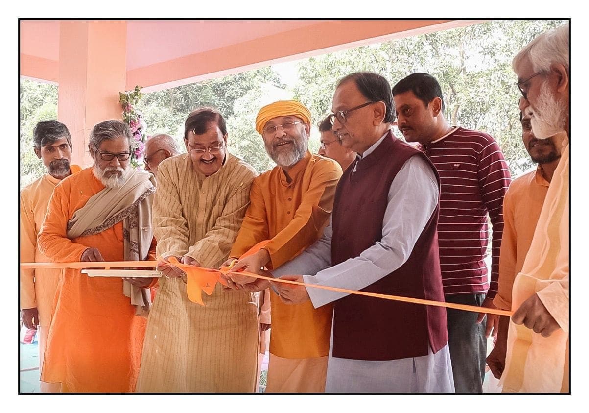 Swami Debananda Maharaj and guests cutting a ribbon together at an opening